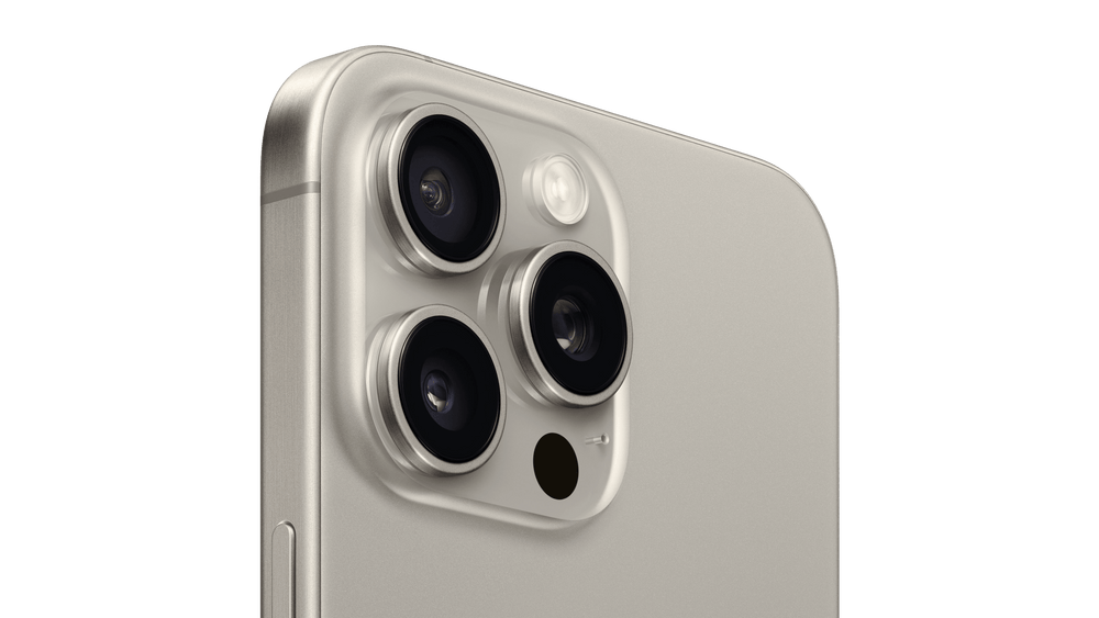 Close-up of a smartphone with camera module on a green background