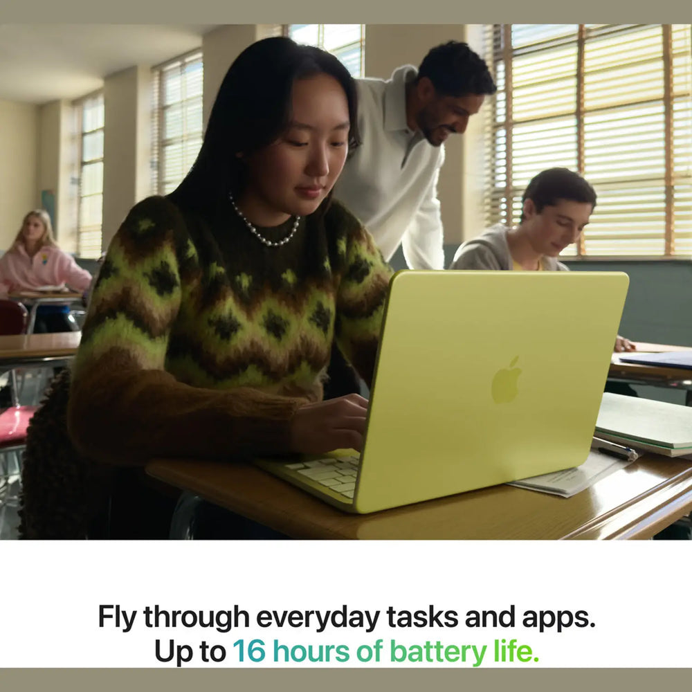 Person using a laptop in a classroom setting with text about battery life.